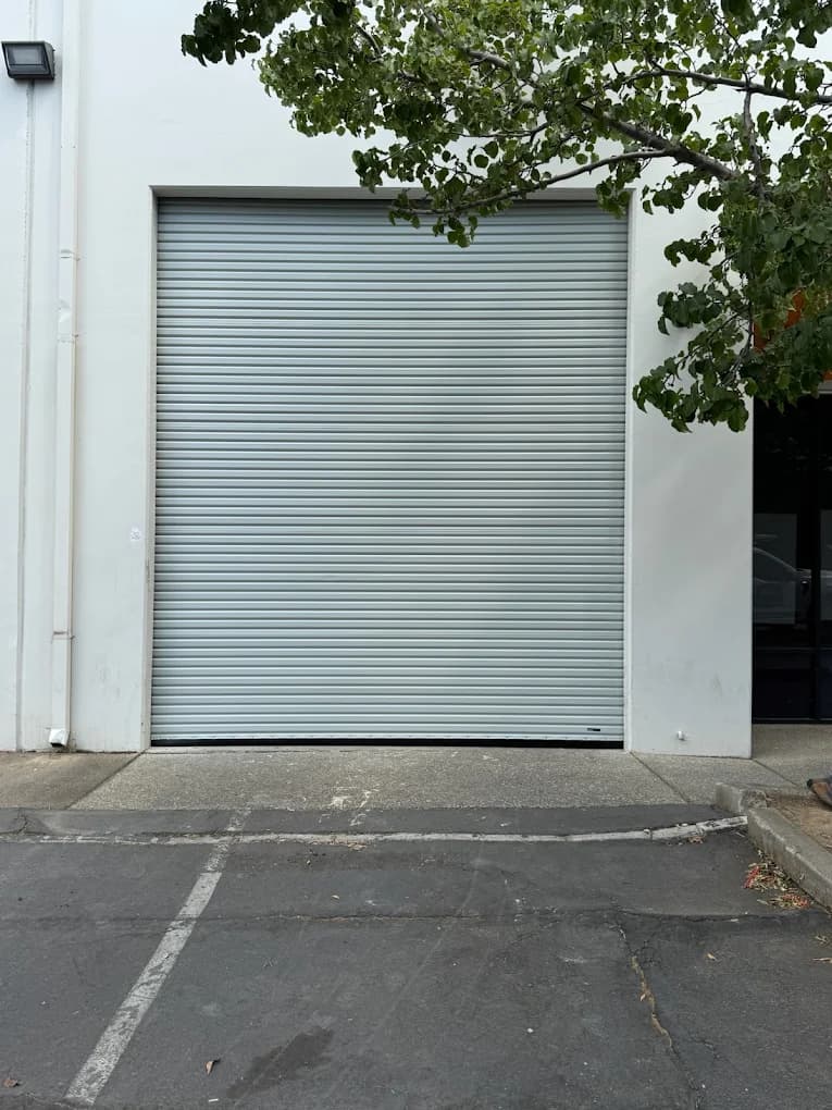 Rolling metal commercial door at a building entrance