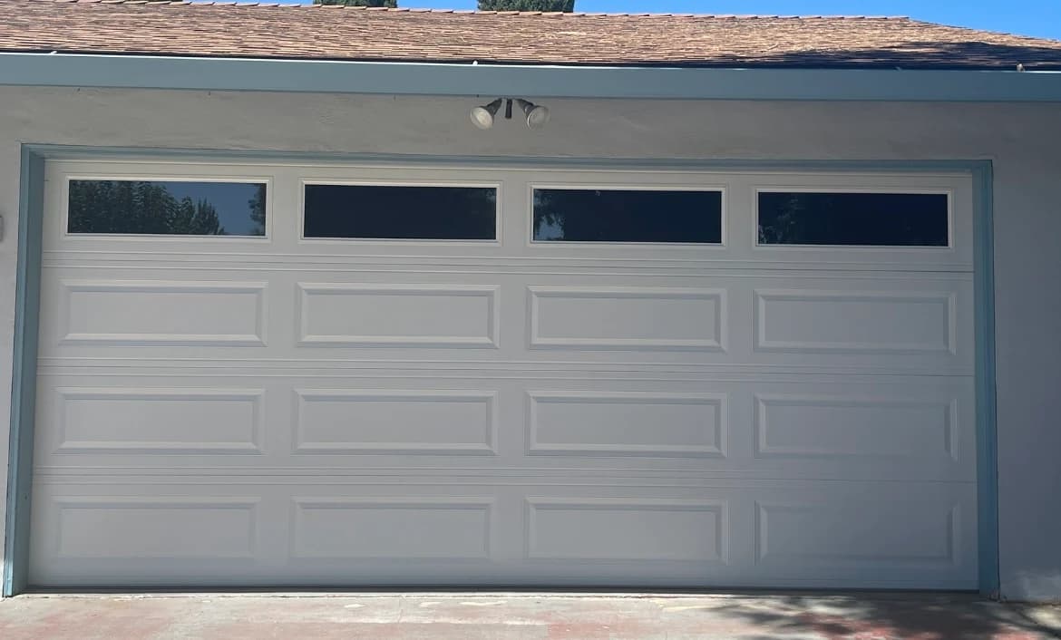 White raised panel garage door replacement